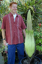 student standing next to bud