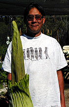 Leo standing next to large bud