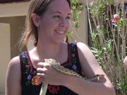 Picture of Robin holding a gopher snake at Zzyzx